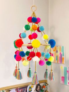 a colorful mobile hanging from the ceiling in a child's room