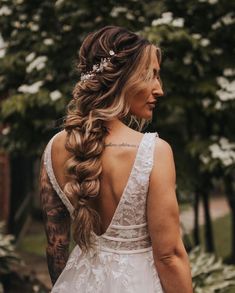 a woman with long hair wearing a wedding dress