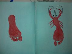 two children's handprints are shown in the shape of lobsters on blue paper