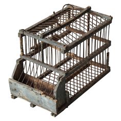 an old wooden crate with metal bars on the bottom and sides, set against a white background