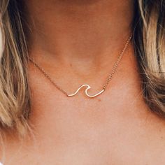 Introducing the newest piece in our killer wave collection: the Coast Necklace! Available in silver, rose gold and gold finishes, this short-chain style features a gnarly wave-shaped charm that’s perfect for all your surf adventures (or just laying by the pool). - Silver: Brass Base w/ White Rhodium Plating- Gold: Brass Base w/ 18K Gold & E-Coating- Rose Gold: Brass Base w/ Rose Gold Plating- Chain: 16" Long 2" Extensions- Charm: 1.2cm (H from bottom to tip of wave) x 4.5cm (L)- Pura Vida Logo T Laying By The Pool, Surfer Chic, Waves Necklace, Gold Wave Ring, Rose Gold And Gold, Wave Necklace, Gold Waves, Surfer Necklace, Beach Necklaces