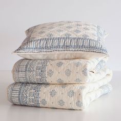 three pillows stacked on top of each other