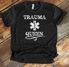 This Trauma Queen design is a funny EMT joke that captures the drama an EMS worker experiences and the truth about how much our medical frontliners help traumatized patients on a daily which, ironically, can also be traumatic for them. If you know someone who is an EMT, paramedic, ER nurse, doctor, or anyone who provides emergency medical services, this design great is for them ----- Check listing pictures for size charts. Let me know if you have any questions! MEN'S UNISEX TEE (Eco-Friendly): T Queen Design, Emt Paramedic, Queen Shirt, Emergency Medical Services, Er Nurse, Queen Tshirt, Moon Shirt, Nurse Doctor, Queen Shirts