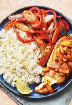 a blue plate topped with chicken, rice and veggies