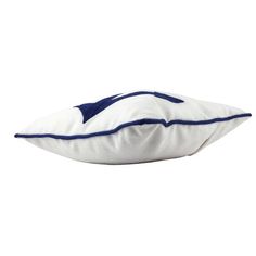 a white and blue pillow on a white background with a black stripe down the middle