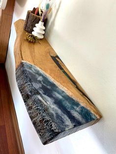 a piece of wood that is on the wall