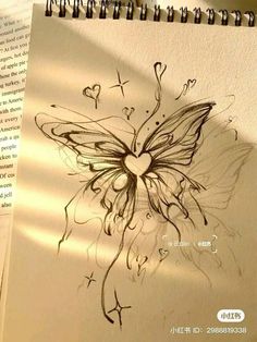 a drawing of a butterfly with hearts on it