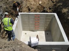 construction workers are working on the foundation of a building