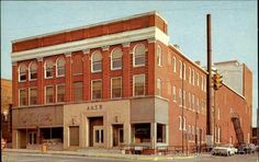 an old brick building on the corner of a street