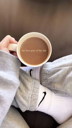 someone holding a cup of coffee with the words, the best part of the day