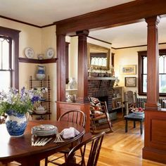 a living room filled with lots of furniture and decor on top of wooden flooring