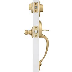 a white and gold door handle with two knobs on the outside side of it