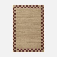 a beige rug with red and brown squares on it, in the middle of a white background