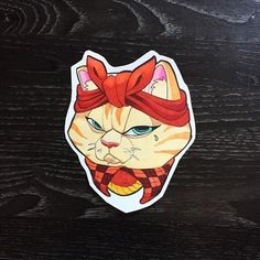 an orange and white cat sticker with a red bow on it's head