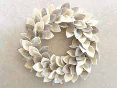 a wreath made out of paper with leaves