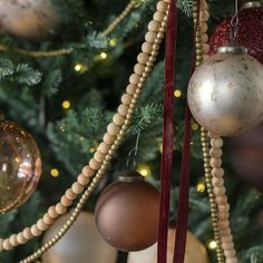 a christmas tree with ornaments hanging from it