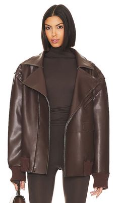 Find NORMA KAMALI Oversized Moto Jacket on Editorialist. Norma Kamali Oversized Moto Jacket in Chocolate. - size L (also in M, S, XL, XS, XXS) Norma Kamali Oversized Moto Jacket in Chocolate. - size L (also in M, S, XL, XS, XXS) Make a bold statement on your night out with Norma Kamali's Military Oversized Moto Jacket. Crafted from leather fabric with a slouchy fit, this jacket is the perfect choice for a stylish and edgy evening look.. Self: 100% polyurethane Back: 90% polyester 10% spandex. Made in China. Machine wash. Front asymmetrical zipper closure. Ribbed cuffs and hem. Side flap pockets. Midweight faux leather fabric. style runs large, size down. NKAM-WO172. ST3234LV054028. The first designer to receive a plaque on New York's 7th Avenue, she is credited with inventing the sleeping Oversized Biker Leather Jacket For Fall, Oversized Biker Jacket For Fall, Oversized Biker Outerwear For Fall, Oversized Winter Biker Jacket, Oversized Biker Jacket For Workwear With Long Sleeves, Oversized Long Sleeve Biker Jacket For Work, Oversized Biker Jacket With Zipper For Fall, Oversized Biker Jacket For Workwear In Fall, Winter 2024 Fashion Trends