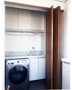 a washer and dryer in a small room