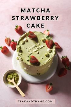 there is a cake with strawberries on it and the words matcha strawberry cake