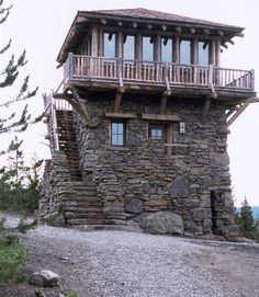 an old stone building with wooden balconies