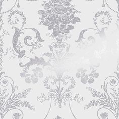 a white and grey wallpaper with an ornate design on the bottom half of it