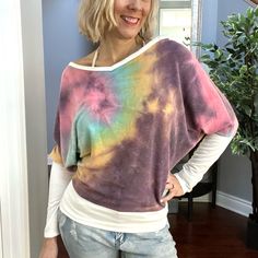 A Long Sleeve Tie Dye Knit Top With A V-Neck Featuring A Solid Trim Detail And A Reverse Stitching. Fabric Is Soft And Comfortable. Model Is 5'7" And Is Wearing A Size Small. Multicolor Knit V-neck Top, Multicolor V-neck Knit Top, Multicolor V-neck Knit Top For Summer, Multicolor V-neck Knit Top For Spring, Casual Multicolor Knit Top For Day Out, Multicolor Knit Top For Day Out, Bohemian Knit Tops For Loungewear, White Bohemian V-neck Knit Top, White V-neck Bohemian Knit Top