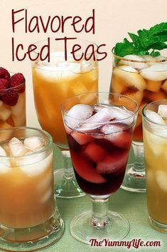 four glasses filled with iced teas on top of a table