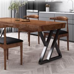 a wooden table with black chairs in a kitchen