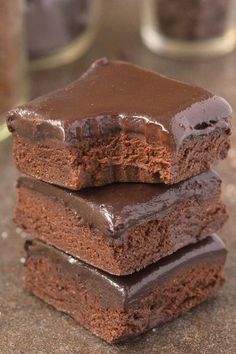 three chocolate brownies stacked on top of each other