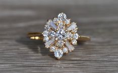 a diamond ring sitting on top of a wooden table