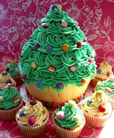 there are cupcakes with green frosting and sprinkles