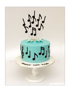 a blue cake with musical notes on it