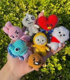 small crocheted animal keychains in the palm of someone's hand