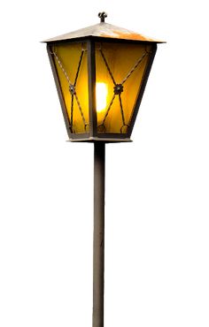 a lamp that is on top of a metal pole with a yellow light in the middle