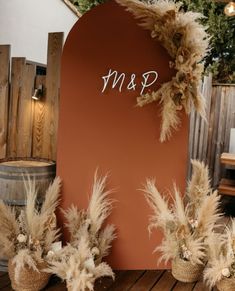 a couple of vases sitting on top of a wooden table next to a sign