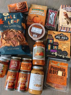 an assortment of food items are laid out on the floor to be used as gifts