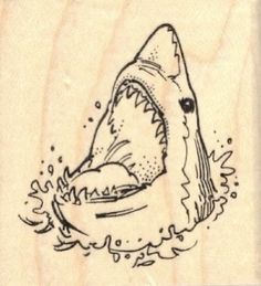 a rubber stamp with a drawing of a shark