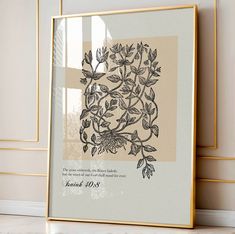 a framed photo with flowers and leaves on it