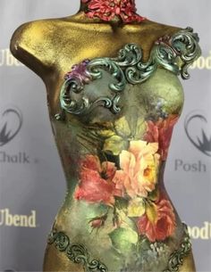 a mannequin with flowers painted on it