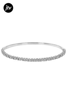 1.00ctw baguette and round white diamond, rhodium over 14k white gold bangle bracelet. Measures approximately 1/16"W and has a push button hidden box clasp closure. White Gold Bangle, Box Clasp, Gold Bangle Bracelet, Gold Bangle, Push Button, Gold Bangles, White Diamond, Bangle Bracelet, Bangle Bracelets