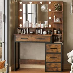 a vanity with lighted bulbs and drawers in front of a mirror that has lights on it