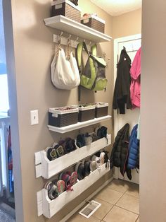 there are many shoes and bags on the shelves