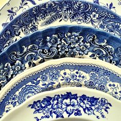 blue and white plates stacked on top of each other