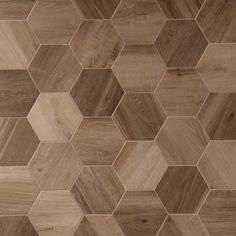 a wooden floor with hexagonal tiles on the top and bottom half of it