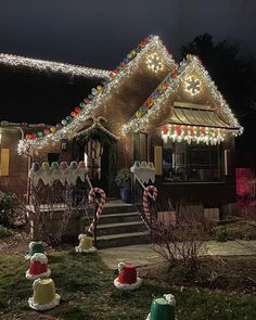 a house decorated with christmas lights and candy canes