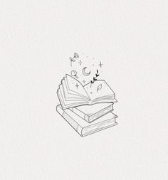 a stack of books sitting on top of each other next to a butterfly flying over them