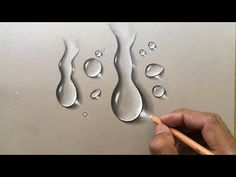 someone is drawing water drops on paper