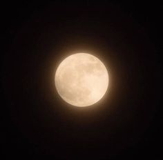 the full moon is seen in the dark sky