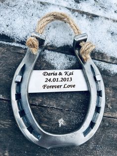 a close up of a metal object with rope on it and a sign that says, darna & kii forever love