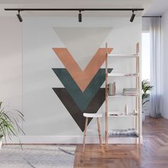 an abstract geometric wall mural with gold, grey and white triangles